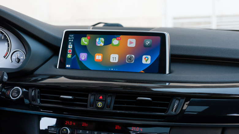A car's center console infotainment screen and controls