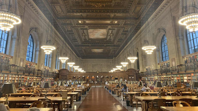 People sit at tables in the NYPL Stephen A. Schwarzman Buliding's Rose Main Reading Room.