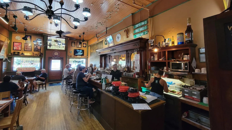 people relax with a meal and drinks at Puempel's Olde Tavern