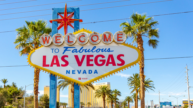 "Welcome to Fabulous Las Vegas Nevada" sign framed by palm trees