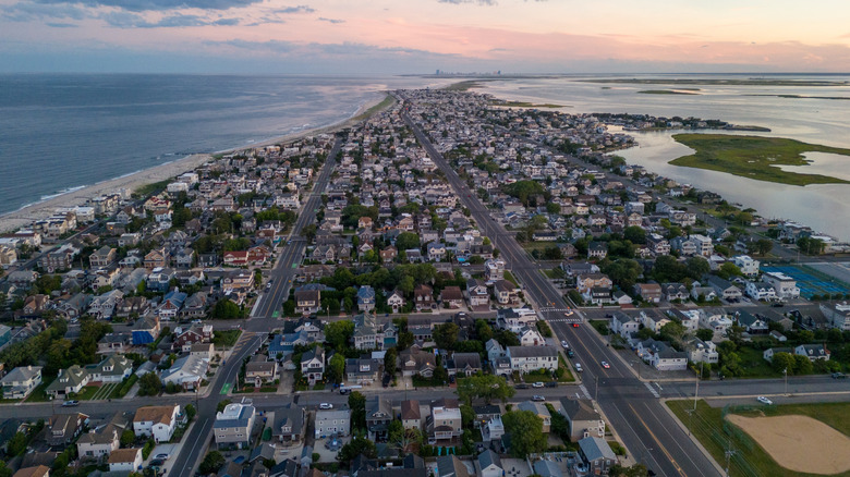 Aerial view of Long Beach Island at sunset, with residential streets surrounded by the ocean