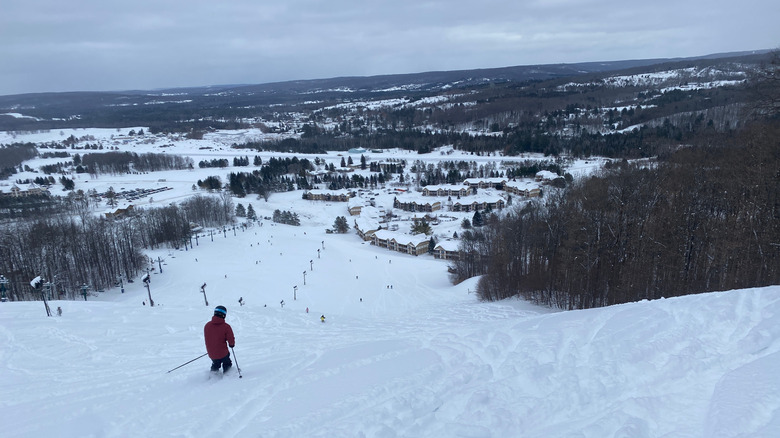 Man skiing downhill at Boyne Mountain Resort in Michigan