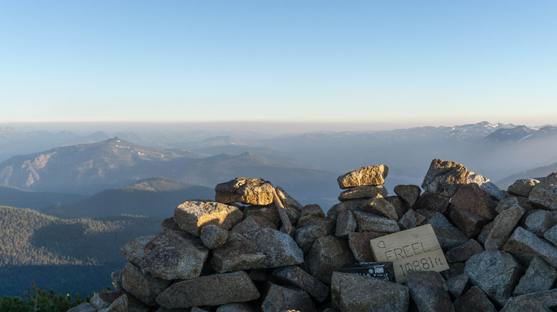 Freel Peak, the highest point in the Lake Tahoe Basin, a pile of rocks and sign noting the 10,881 foot elevation.
