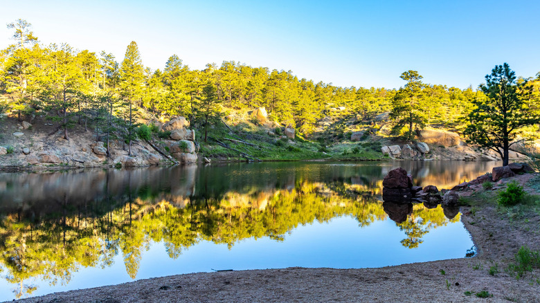Scenic sunrise over Granite Springs Reservoir in Curt Gowdy State Park with calm waters