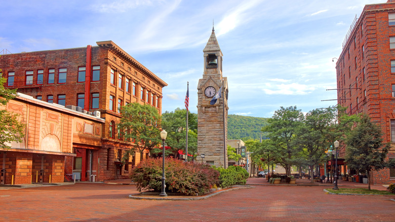 The town square of Corning, NY, with brick buildings and walkways including a clock tower