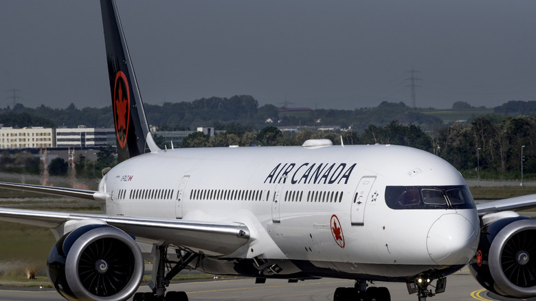 Air Canada plane taxiing on runway