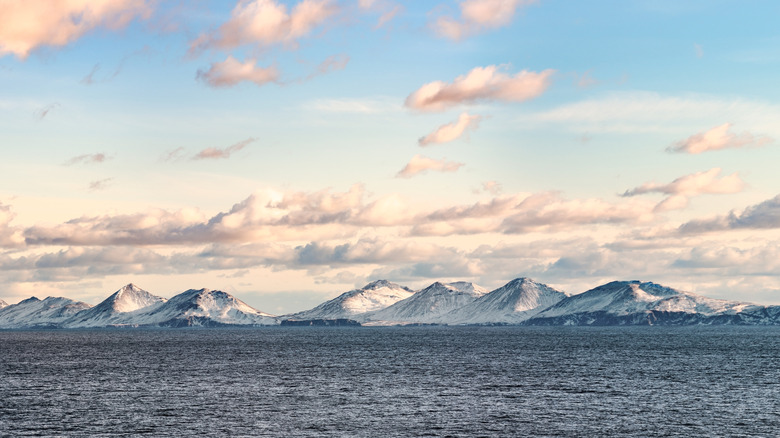 Snow peaks, glaciers and rocks of Aleutian islands