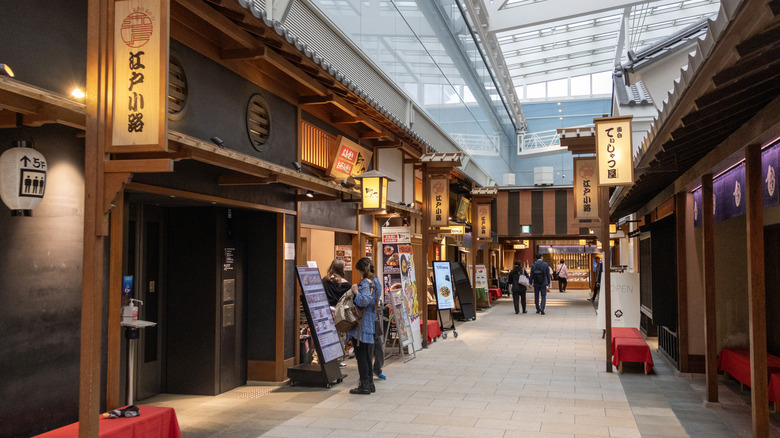 Place inside the Haneda Airport, Japan where shops sell tourists goods from Edo-era recreation buildings