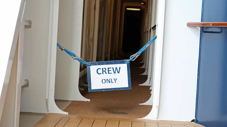 A restricted area on a cruise ship with a Crew Only sign posted