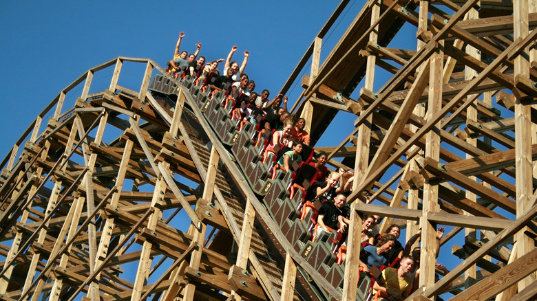 tourists riding El Toro wooden roller coaster at Six Flags Great America in New Jersey