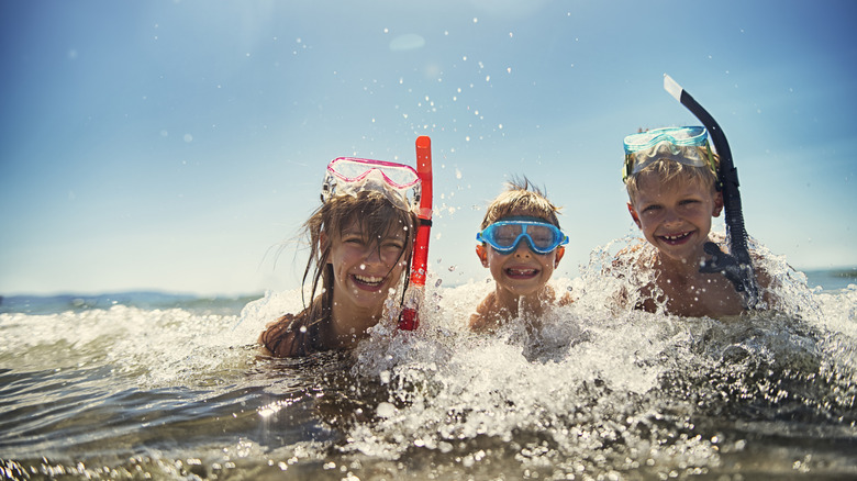Family smile with snorkels
