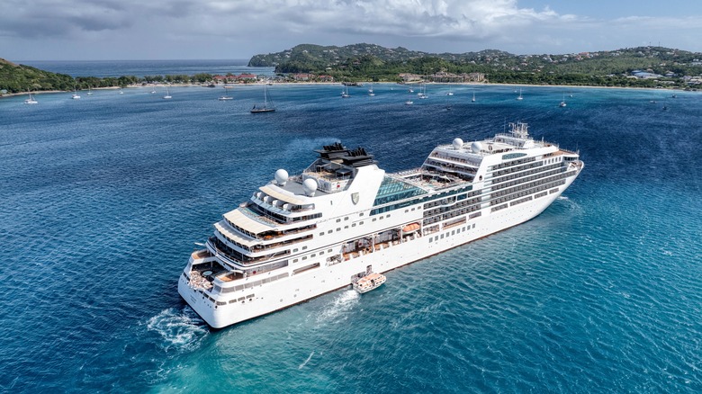 Aerial view of the Seabourn Ovation anchored at Pigeon Island in bright blue water