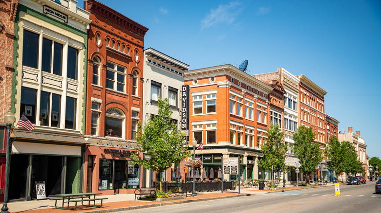 red and white buildings on street under blue sky
