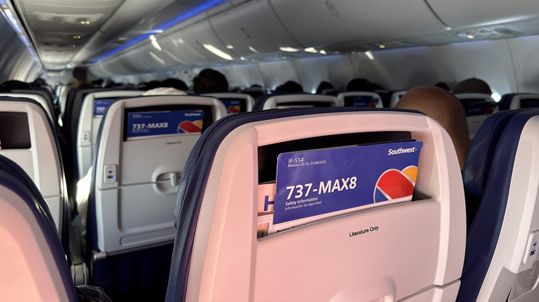 Seats on a Southwest Airlines flight, with a seatback in the foreground