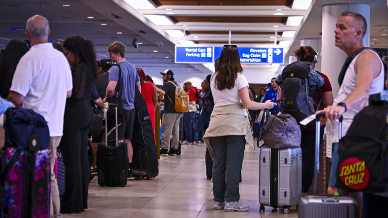 Passengers waiting at Orlando International Airport