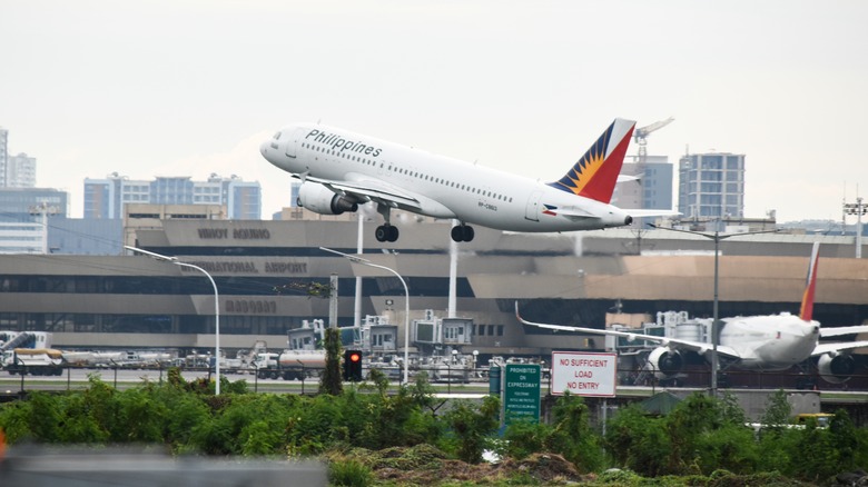 Phillippines Airlines plane taking off at Ninoy Aquino International Airport