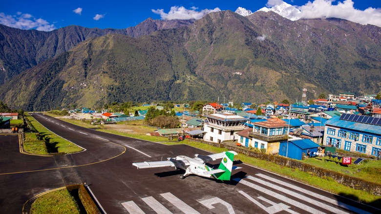 A small plane at the beginning of the runway at the Tenzing Hillary Airport