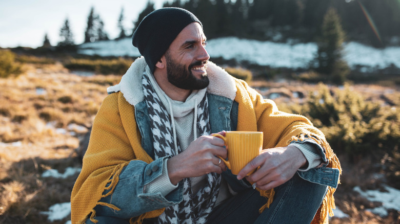 Hiker drinking his morning coffee