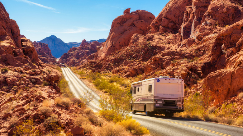 An RV driving through Valley of Fire State Park in Nevada