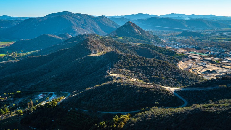 Hiking trails through the Monserat Mountain Preserve with Fallbrook in the background from an aerial view