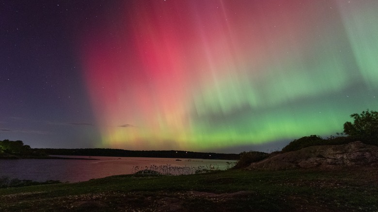 Colorful Northern Lights seen over a lake in Maine