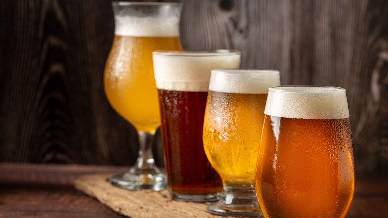 Craft beer lined up on a wood counter