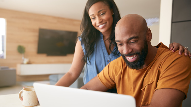 Couple booking a holiday