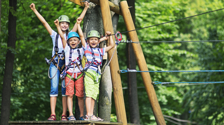 Happy kids ziplining