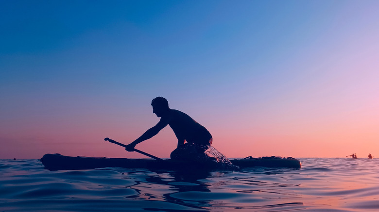 Paddleboarder at sunset