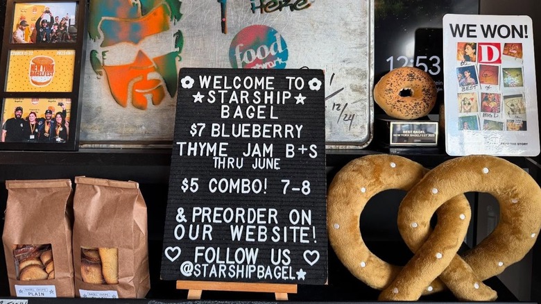 Starship Bagel menu board with decorations on wall