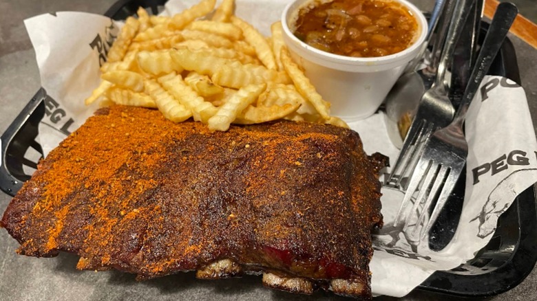 Huge rack of dry rub ribs at Peg leg Porker