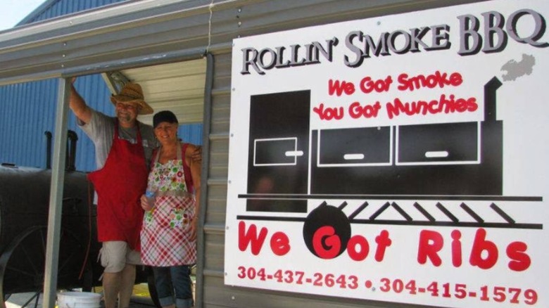 Owners of Rollin Smoke outside their restaurant in West Virginia