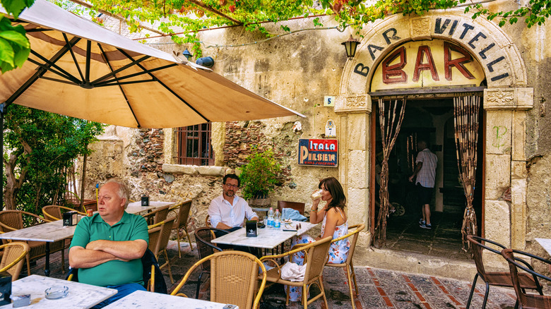People sitting at tables at Bar Vitelli in Savoca, Sicily