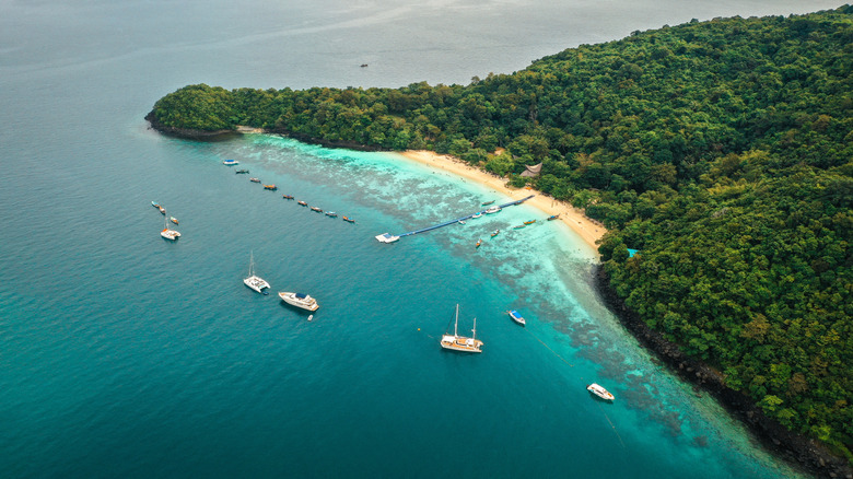 Aerial view of beach and boats on Koh Hey island in Thailand