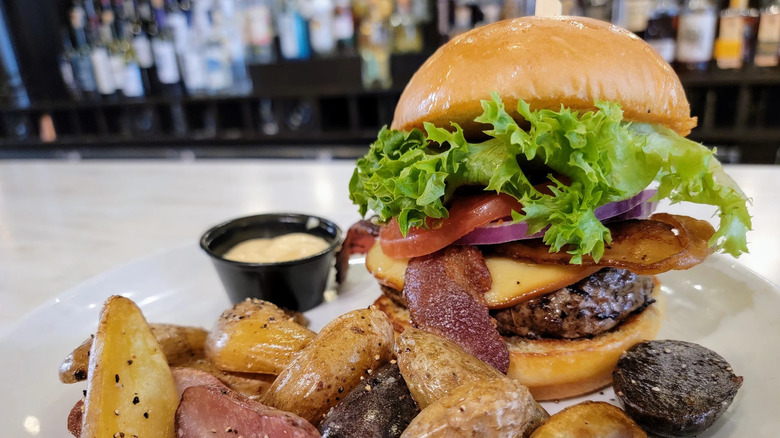 Bacon cheeseburger and roasted potatoes from Mussel & Burger Bar