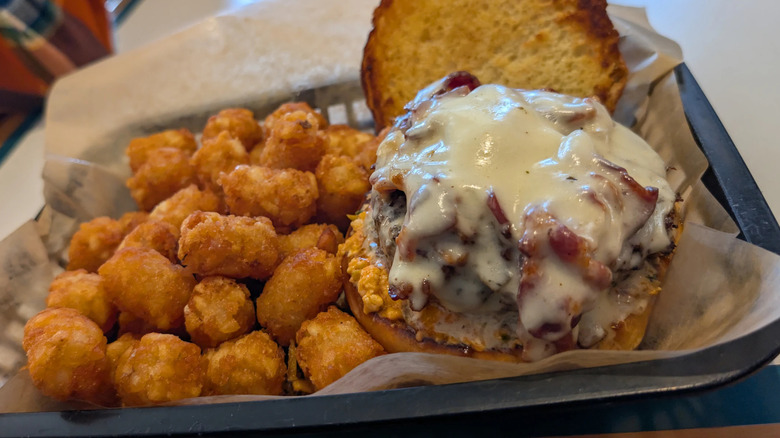 Tator tots and cheesy bacon burger from Blazes Burgers