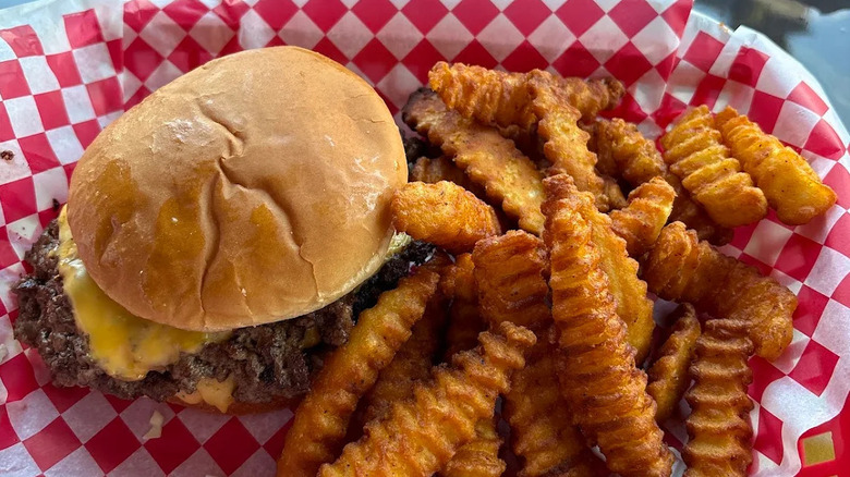 Crinkle fries and cheeseburger from Between the Bunz
