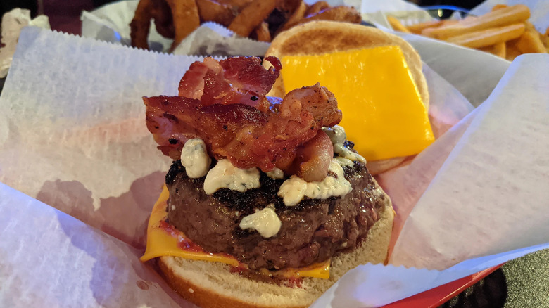 Cheese, bacon, and blue cheese on a burger from Krug's Tavern