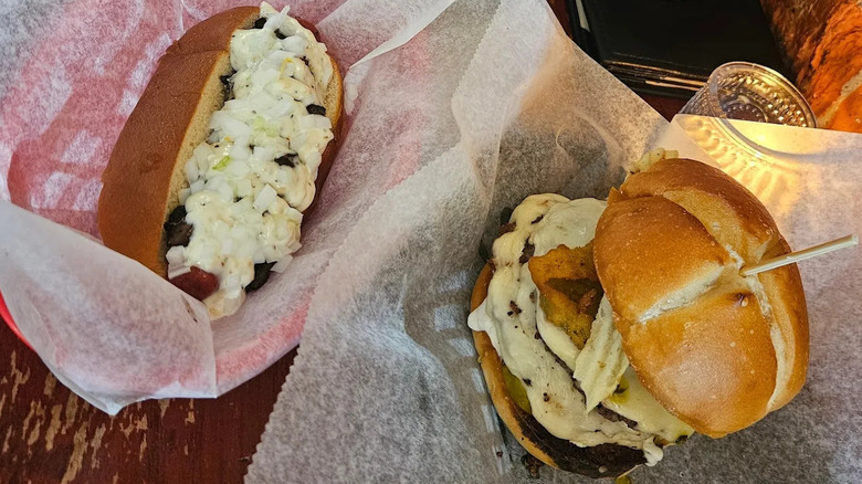 Cheeseburger and cheese-covered hot dog from Lucky's Last Chance