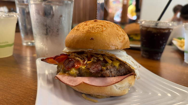 Burger with ham, bacon, and fried egg from Liberty Burger