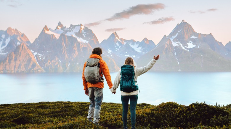 Couple standing on mountain