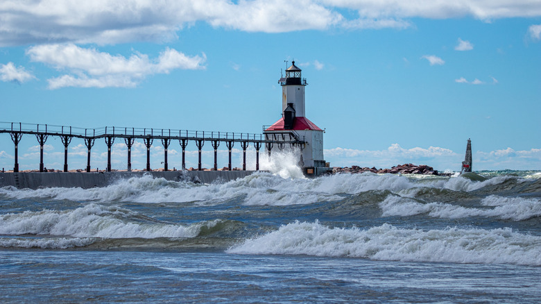 Michigan City Lighthouse on a summer day with high surf in Michigan City, Indiana
