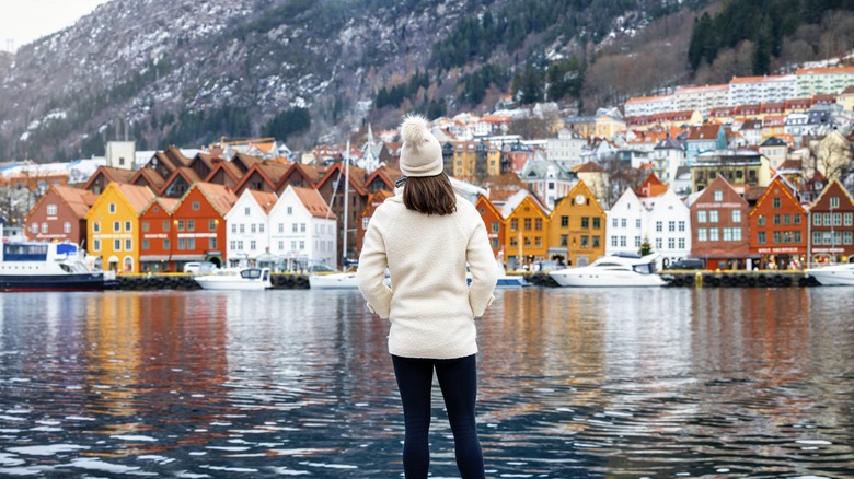 Woman with houses in Bergen, Norway
