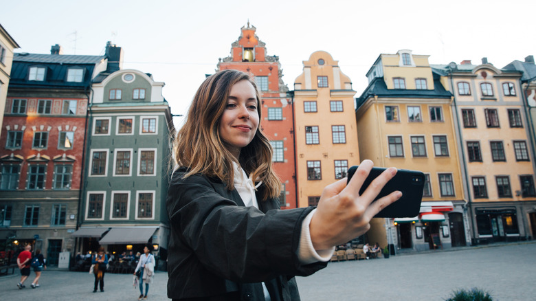 Woman takes selfie in Bruges, Belgium