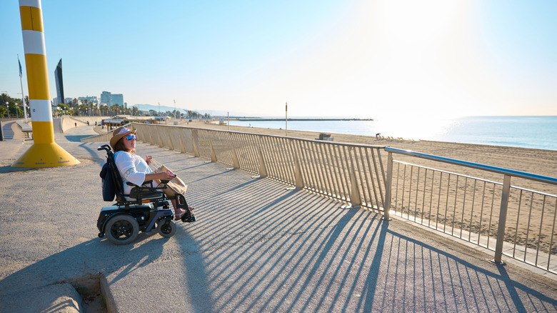 person in wheelchair on Barcelona beach