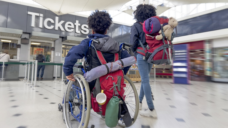 girl in wheelchair in London station