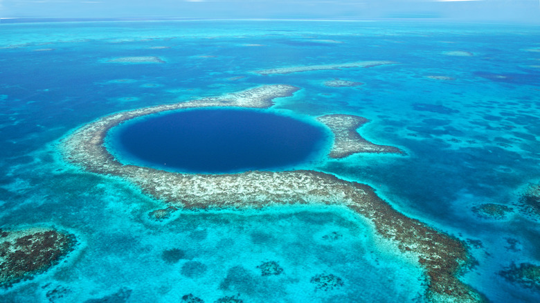 The Blue Hole at the Belize Barrier Reef with its dark blue waters.