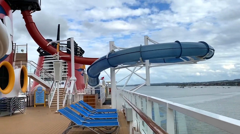 A large blue watertube on the top deck of a ship jutting over the edge