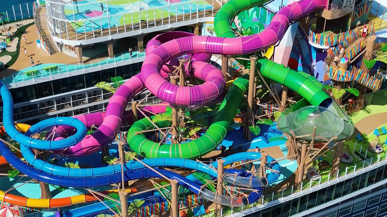 Colorful entanglement of serpentine watertubes as seen over the top deck of a cruise liner