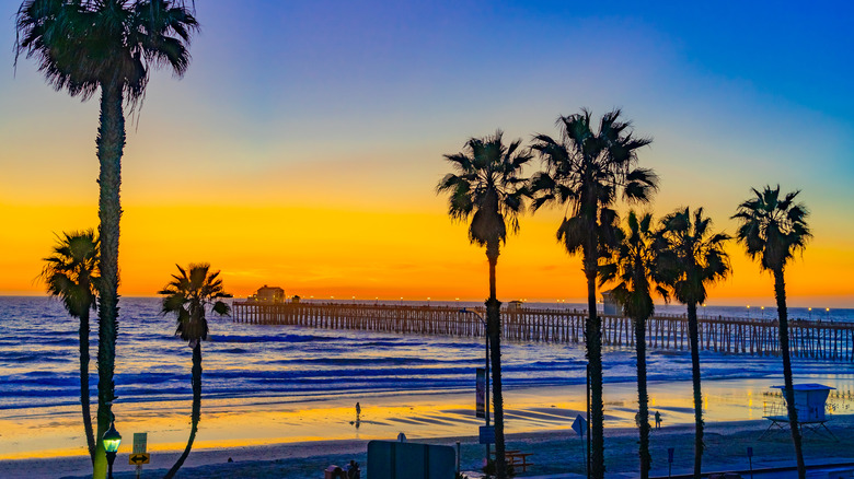 A beautiful sunset over the water looking out to the pier in Oceanside, California